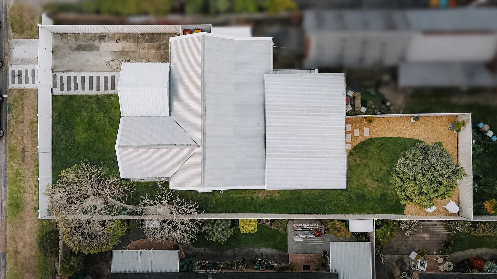Aerial overhead view of Kos Koliba showing the full house and backyard layout